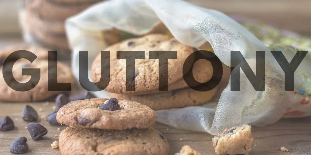 An image of a bag of chocolate chip cookies with large text atop that reads "Gluttony."